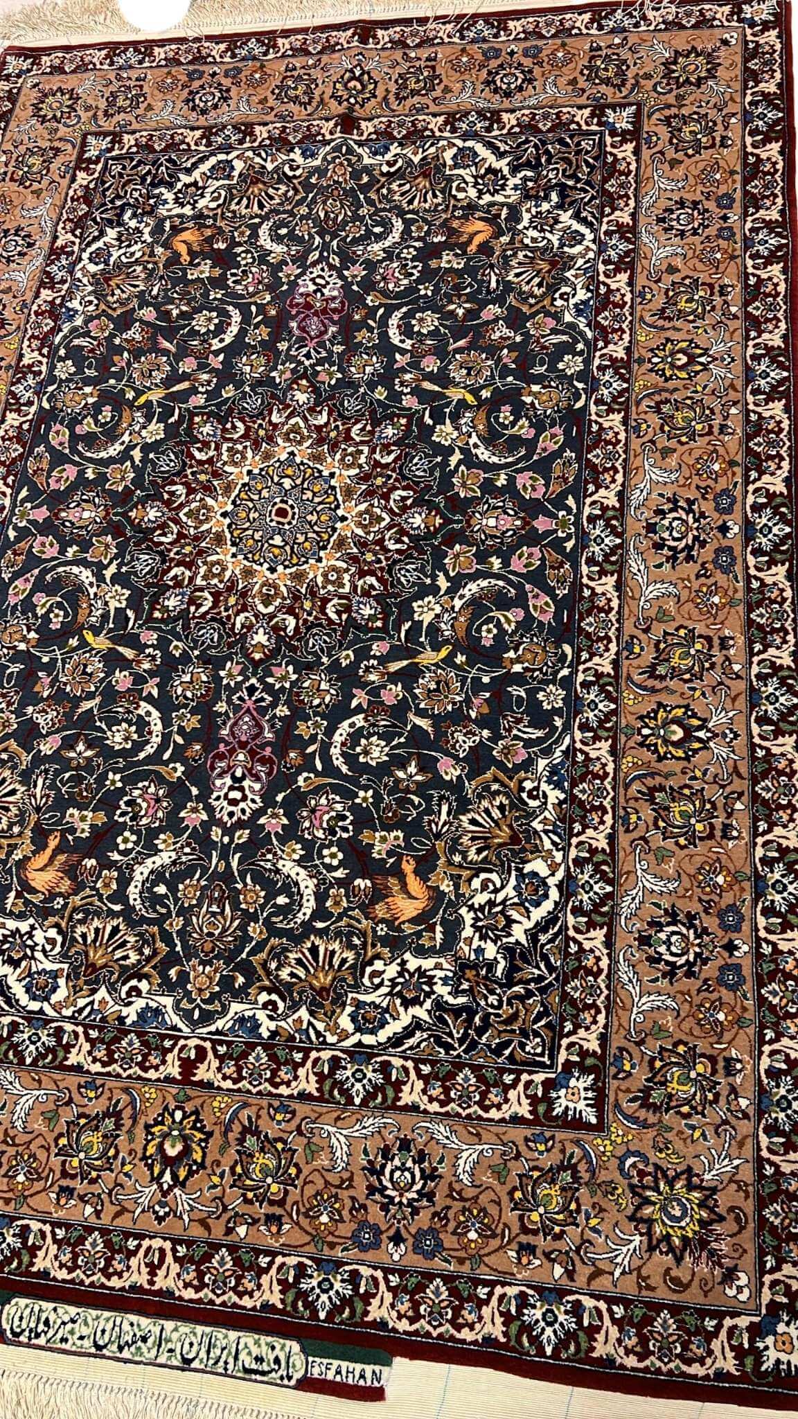 "Luxury Persian rug by Master Hassan Seirafian, crafted from wool and silk with natural dyes, displaying exquisite craftsmanship."